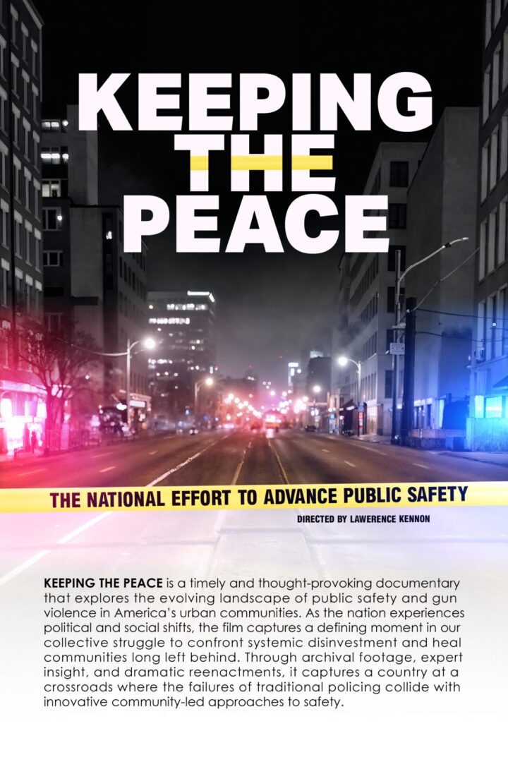 A city street at night with bright lights and a banner promoting peace and public safety.